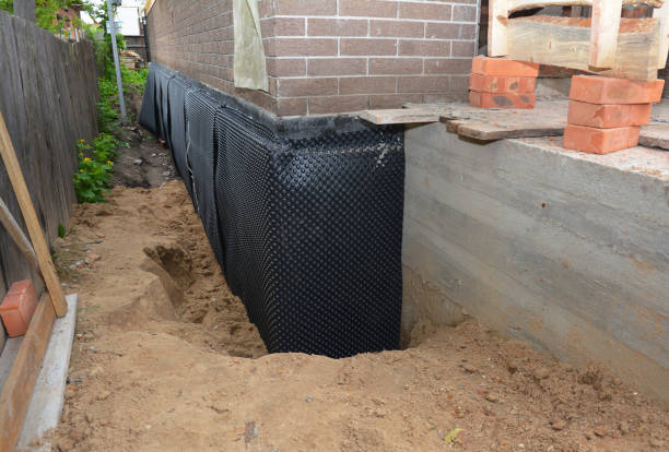 Happy homeowners after waterproofing job in Sumiton
